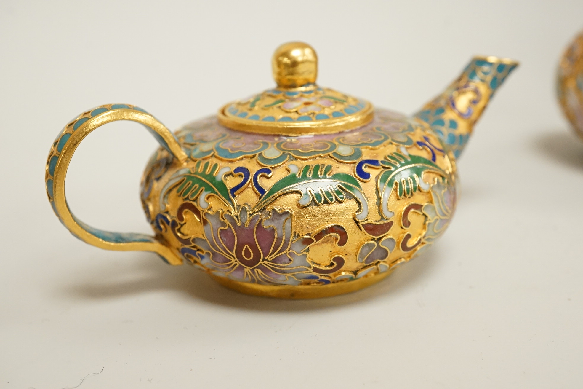 A collection of miniature enamel and cloisonné boxes, eggs and a painted rabbit, etc. (11)